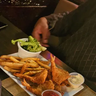 Fried fish, fries and broccoli