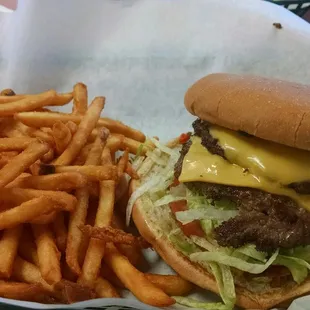 Signature Benny's burger. Green chile, guacamole. Really good. Fries were good too.