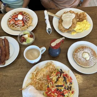 Migas, chicken fried steak and eggs, strawberry waffle