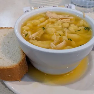 Chicken Soup with bread that seems to be a few days old