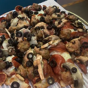 10" sausage , old world pepperoni, mushrooms and olives