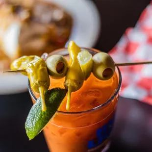 a bloody drink with olives