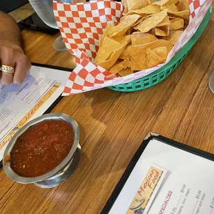 a basket of chips and salsa