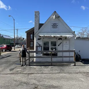Ben in front of the adorable shack