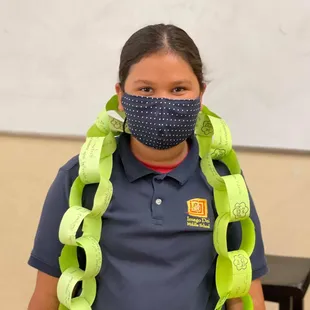 Kind Campus student wrapped in kindness chain
