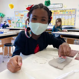 Kind Campus student working with clay