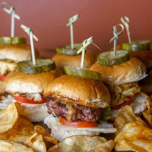 a pile of sandwiches with pickles