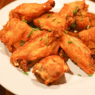 a plate of fried chicken wings