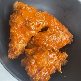 Breaded wing dings with buffalo sauce! The breading is so light and crispy. Brined and seasoned perfectly...juicy and delish!