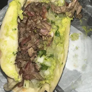 Steak fajitas tacos with guacamole and onions