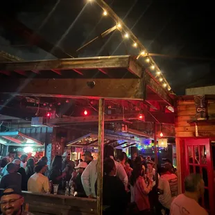 a crowd of people at a bar