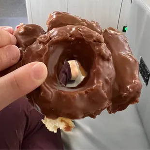 Chocolate glazed donut -- glaze was so good (Background is our RV, not the donut shop)