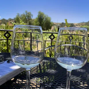 two glasses of wine on a table