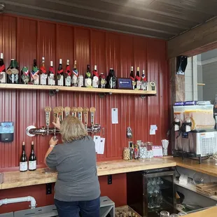 a woman standing at a bar