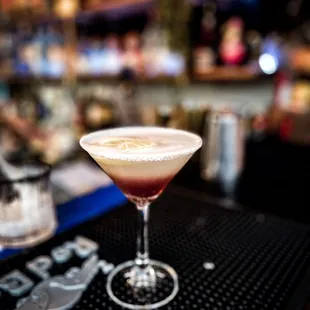 a cocktail in a martini glass