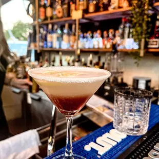 a cocktail in a martini glass