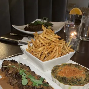 NY strip, truffle frites, creamed spinach  Ribeye with whipped potatoes and asparagus