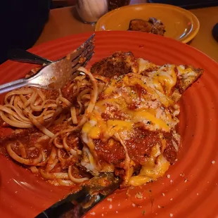 a plate of spaghetti and meat