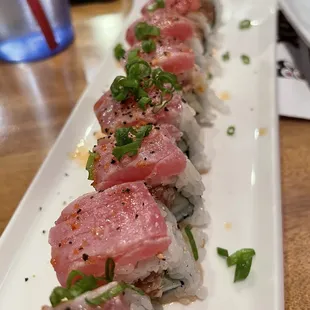 a long rectangular plate of sushi