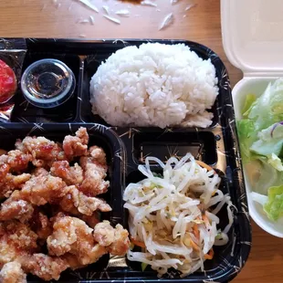 chicken, rice, salad, and salad dressing