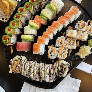 a plate of sushi and chips