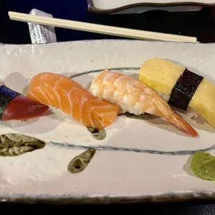 Clam, salmon, shrimp and tomago (egg) nigiri