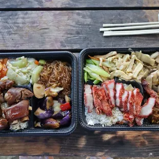 two trays of food on a picnic table