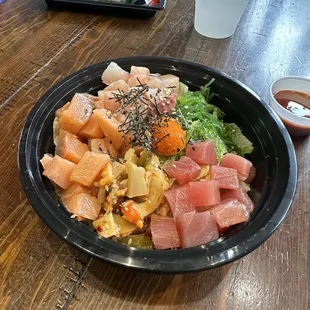 Poke Bowl and Salmon role in the background.
