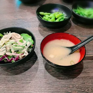 a bowl of soup and a bowl of salad