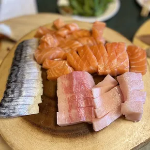 a variety of fish on a cutting board