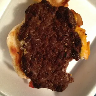 The "re-used from a previous order" burger, dark brown hard outside
