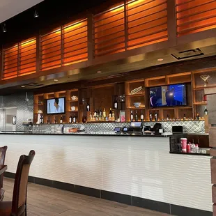 a bar with a television in the back