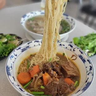 Mi Bo Kho, at least here you can have rice noodle, egg noodle or bread options. Much better than pho Saigon