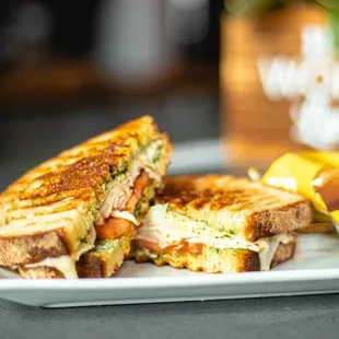 MEDINA PANINI - Home made basil pesto sauce, fresh sliced Turkey, Swiss cheese and Roma tomatoes.