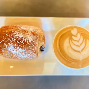 Homemade chocolate croissant and caramel latte