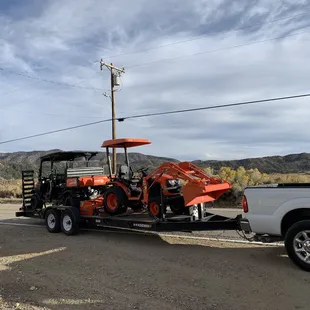 RTV &amp; tractor being delivered.