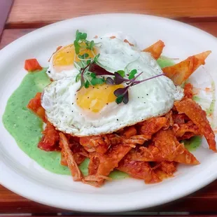 Pasta Chiliquiles (fried eggs, pulled pork, crème fraiche, tomatillo avocado sauce).