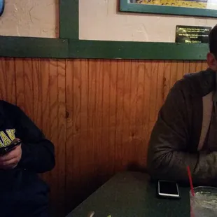 two men sitting at a table