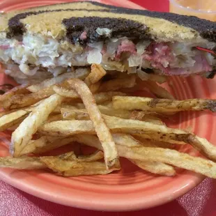 a sandwich and fries on a plate