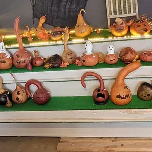 a display of pumpkins and gourds