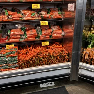 a display of carrots and other vegetables