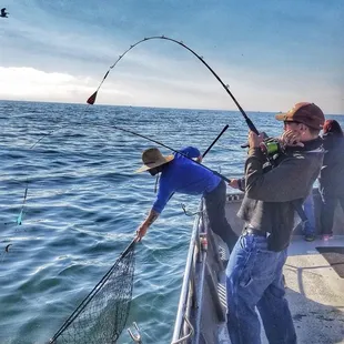 One of the guys catchn a fish and the deckhands gettn ready to net it 8/20/20