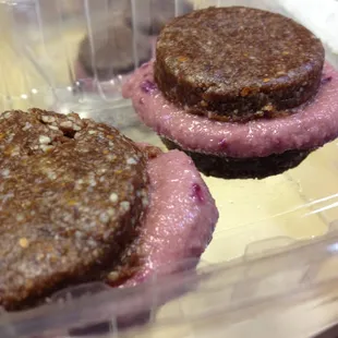 raw vegan chocolate cookie sandwich with strawberry filling