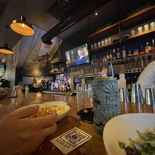 people eating at a bar