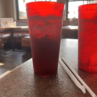 a coke glass and a straw