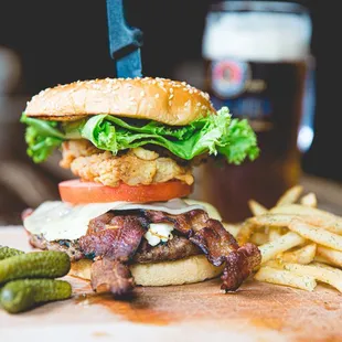 a burger and fries on a cutting board