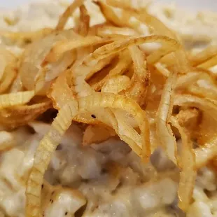 Hausgemachte Kasespatzle $12 Chef Peter homemade cheese spaetzles, served with fried onions