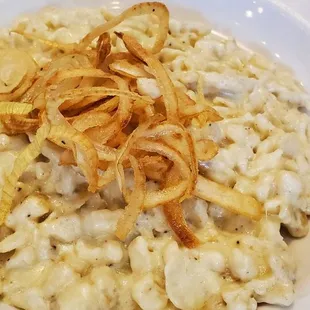 Hausgemachte Kasespatzle $12 Chef Peter homemade cheese spaetzles, served with fried onions
