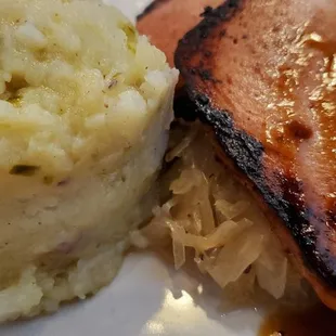 Leberkase: a loaf of ground pork, bacon &amp; corned beef that is browned &amp; served over Sauerkraut with Potato salad or French fries