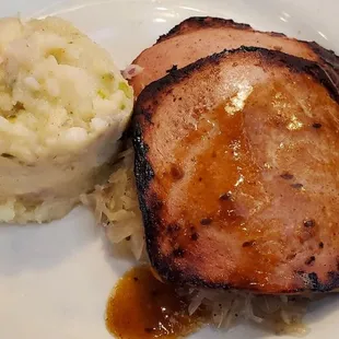 Leberkase: a loaf of ground pork, bacon &amp; corned beef that is browned &amp; served over Sauerkraut with Potato salad or French fries